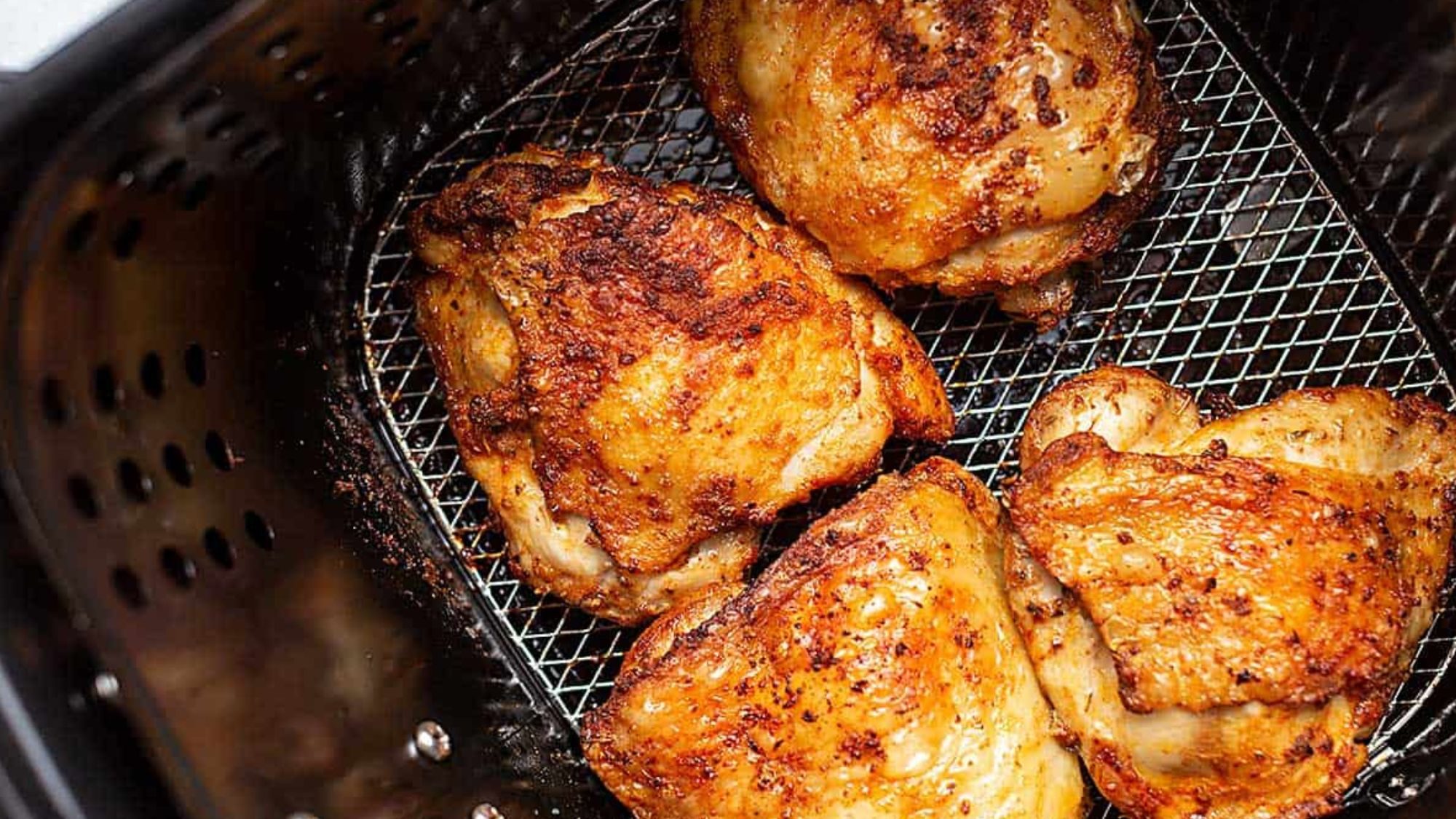 Chicken breast pieces in a chicken fryer