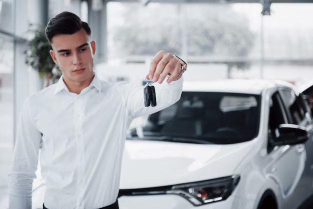 happy-young-man-with-keys-his-hands-lucky-buy-car_146671-14727-1