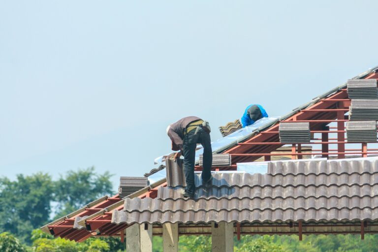 worker-installing-roof-tiles-1